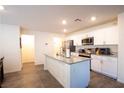 Bright kitchen featuring white cabinets, stainless appliances, and kitchen island at 2678 Weathered Copper Ave, North Las Vegas, NV 89086
