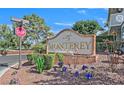 The Monterey community sign with beautiful flowers and landscaping on a clear day at 2831 Geary Pl # 2918, Las Vegas, NV 89109