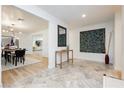 Spacious entryway with stylish decor, flowing seamlessly into the dining and living areas with an open floor plan at 3007 La Mesa Dr, Henderson, NV 89014