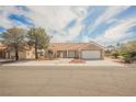 Beautiful single-story home featuring a well-maintained yard and a two-car garage at 3116 Richland Dr, Las Vegas, NV 89134