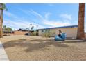 Charming single-story home with a low-maintenance desert landscape and mature palm trees at 3140 Sundown Dr, Las Vegas, NV 89169