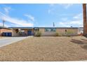 Quaint single-story house boasting a desert landscape, mature trees, and a convenient covered parking area at 3140 Sundown Dr, Las Vegas, NV 89169