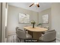 Inviting dining room with modern light fixture, soft paint, and a neutral color palette throughout at 3825 Ormond Beach St # 203, Las Vegas, NV 89129