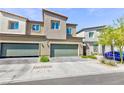 Two-story townhome with a modern design and desert landscaping for low maintenance at 4145 Lunar Canyon Ave, North Las Vegas, NV 89084