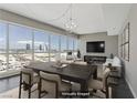 Spacious dining area with modern chandelier and panoramic city views at 4575 Dean Martin Dr # 1208, Las Vegas, NV 89103