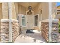 An inviting entrance with stone accents and a stylish front door welcomes you to this beautifully designed home at 4878 Friar Tuck Ave, Las Vegas, NV 89130