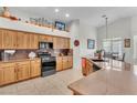 Well-equipped kitchen with stainless steel appliances, granite countertops, and ample cabinet space offers both style and functionality at 4878 Friar Tuck Ave, Las Vegas, NV 89130