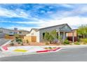 Corner lot home featuring desert landscaping and a well-maintained exterior at 669 Assurance Pl, Henderson, NV 89011