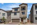 Charming two-story home featuring a balcony, a two-car garage, and meticulous landscaping, adding curb appeal to this lovely residence at 7482 Lodano Ave, Las Vegas, NV 89113