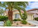 Charming single-story home featuring a well-maintained landscape and attached two-car garage at 7608 Vista Hills Dr, Las Vegas, NV 89128