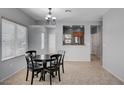 Dining room with ample natural light and view to the kitchen for easy serving at 7732 Songster St, North Las Vegas, NV 89084