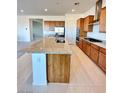 Spacious kitchen with a large island, stainless steel appliances, and granite countertops at 80 Brixton Ave, Henderson, NV 89011