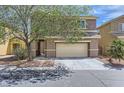 Inviting two-story home with a two-car garage, neat landscaping, and a covered entryway, offering great curb appeal at 8084 Celina Hills St, Las Vegas, NV 89131