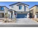 Charming two-story home with a gray tiled roof and a matching gray two-car garage door at 8351 Gold River Ct, Las Vegas, NV 89113