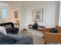Comfortable living room with stylish furniture, neutral tones, and ample natural light at 9159 Oxford Blue Ave, Las Vegas, NV 89148
