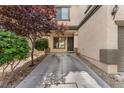 View of the front entry and driveway of townhome at 9737 Darlington Ct, Las Vegas, NV 89149