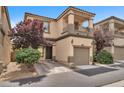 View of the front exterior and driveway of townhome at 9737 Darlington Ct, Las Vegas, NV 89149