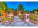 Manicured landscaping with stone mailbox at 9920 Rancho Destino Rd, Las Vegas, NV 89183