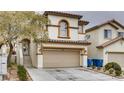 Attractive two-story home with a tan stucco exterior and a convenient two-car garage at 9772 Splendor Sky Ave, Las Vegas, NV 89148