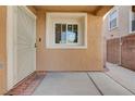 Covered front door entrance featuring security screen and welcome mat at 11120 Whooping Crane Ln, Las Vegas, NV 89144