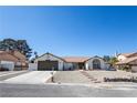 Charming single-story home with well-maintained landscaping and inviting curb appeal at 3156 Shadowridge Ave, Las Vegas, NV 89120