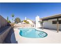 Refreshing pool area with a sparkling pool and ample space for relaxation and entertaining at 3156 Shadowridge Ave, Las Vegas, NV 89120