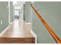 Hallway featuring laminate flooring, leading to living spaces and bedrooms with neutral wall colors at 10001 Peace Way # 2277, Las Vegas, NV 89147