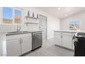 Modern kitchen featuring stainless steel appliances, white cabinetry and subway tile backsplash at 1720 Hassett Ave, Las Vegas, NV 89104