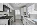 Modern kitchen featuring stainless steel appliances, white cabinets and countertops at 3404 Winterhaven St # 204, Las Vegas, NV 89108