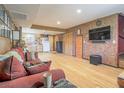 Open concept living room with kitchen view, hardwood floors, and comfortable seating at 438 Las Casitas Way, Las Vegas, NV 89121