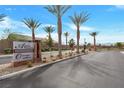 Inviting neighborhood sign at Alpha Omega Pointe community, enhanced by desert landscaping and palm trees at 4505 Meline Ave, North Las Vegas, NV 89084