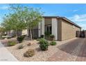 Beautiful single-story home featuring desert landscaping with rock groundcover and a brick driveway at 4505 Meline Ave, North Las Vegas, NV 89084