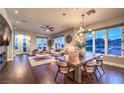 Spacious living room features hardwood floors, ample natural light, and stylish dining set at 47 Strada Principale, Henderson, NV 89011