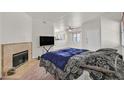 Spacious bedroom featuring carpeted floors, fireplace, and contemporary decor, perfect for relaxation at 5250 S Rainbow Blvd # 1144, Las Vegas, NV 89118