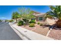 Charming single-story home with desert landscaping, mature trees, and well-maintained lawn at 5820 Amber Station Ave, Las Vegas, NV 89131