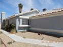 Well-maintained one-story home with desert landscaping, sidewalk and some greenery at 5912 Wabusca Way, Las Vegas, NV 89142
