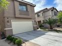 Charming two-story home with a two car garage and well-manicured landscaping at 6495 Chettle House Ln, Las Vegas, NV 89122