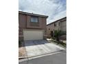 Charming two-story home with a two car garage and well-manicured landscaping at 6495 Chettle House Ln, Las Vegas, NV 89122