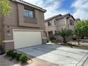 Charming two-story home with a two car garage and well-manicured landscaping at 6495 Chettle House Ln, Las Vegas, NV 89122