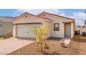 Beautiful single-story home with a two-car garage and desert landscaping at 6760 Violet Cascade Ave, Las Vegas, NV 89156