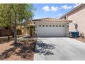 Charming single-story home featuring a well-maintained yard and a two-car garage at 7441 Aurora Glow St, Las Vegas, NV 89139