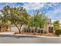Well-maintained single-story home with desert landscaping, two-car garage, and secure gated access at 7716 Twin Tails St, Las Vegas, NV 89149