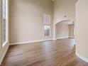 Spacious living room with high ceilings and wood floors, bathed in natural light at 7808 Brook Valley Dr, Las Vegas, NV 89123