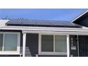 Close-up of the solar panels and front windows of the charming home at 904 Rockaway St, Las Vegas, NV 89145