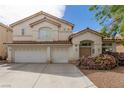 Charming two-story home with a spacious driveway and a well-maintained front yard at 9339 Bondeno St, Las Vegas, NV 89123