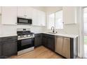 Features stainless steel appliances, white cabinets, and modern countertops at 1069 Silver Bullet Ct, Henderson, NV 89011