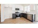 Features stainless steel appliances, white cabinets, and modern countertops at 1069 Silver Bullet Ct, Henderson, NV 89011