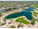 Aerial view showcasing a community lake and golf course creating a picturesque and desirable neighborhood setting at 11359 Winter Cottage Pl, Las Vegas, NV 89135