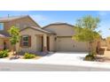 Charming single-story home with a two-car garage and desert landscaping at 13 Deseo Ct, North Las Vegas, NV 89031