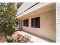 Exterior view of condo featuring security door and black tinted windows at 1361 E University Ave # 106, Las Vegas, NV 89119